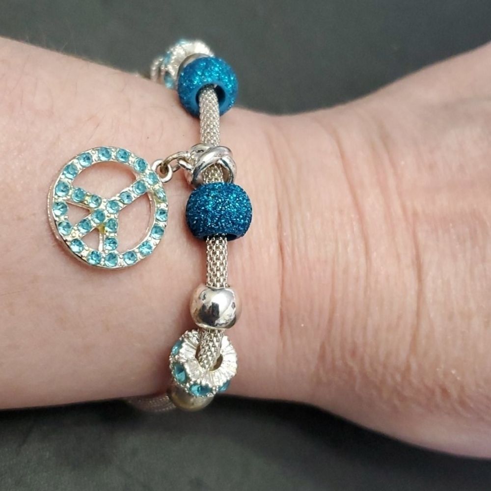 Silver tone and blue charm bracelet peace sparkly 7-9"